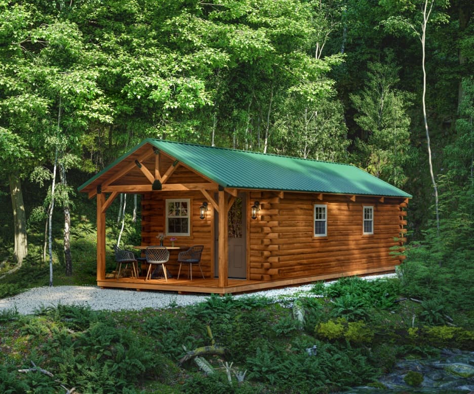 Log cabin with covered front porch in woodland setting
